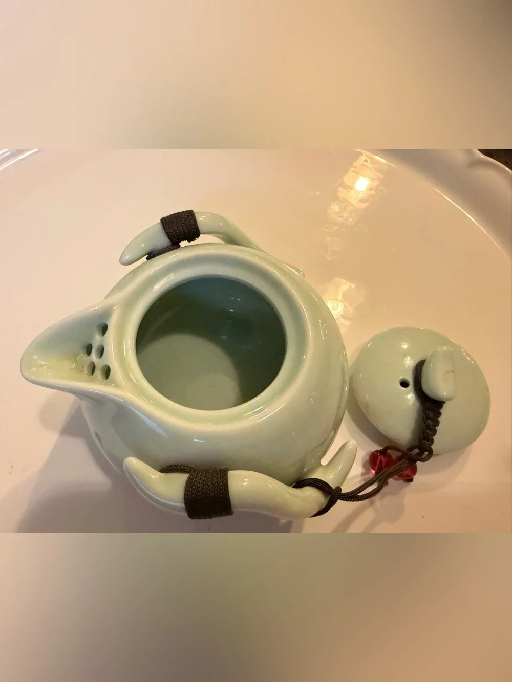 Ceramic Pale Green Mini Teapot with Integrates Strainer,Brown Cord and Red Beads